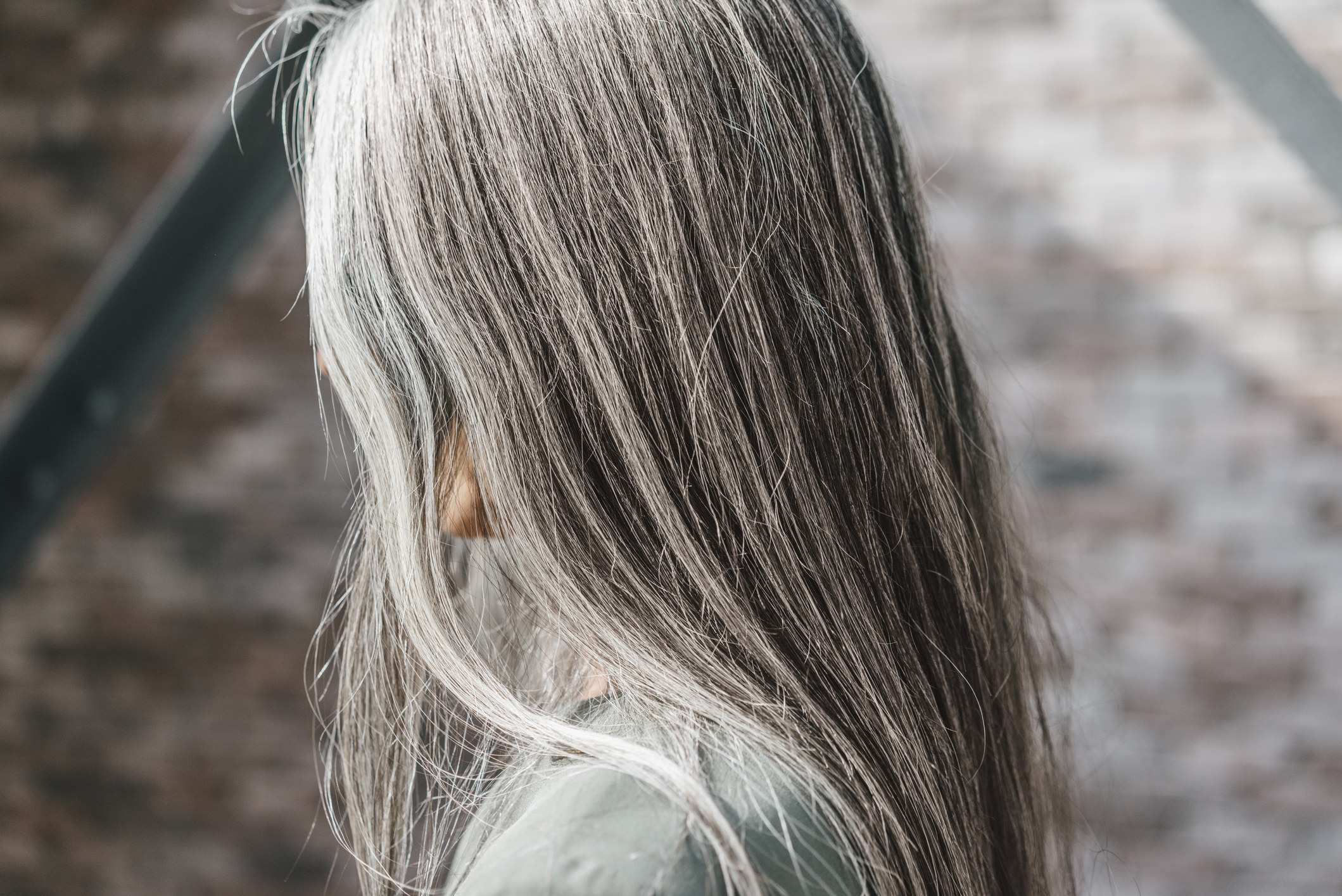 A woman with long gray hair