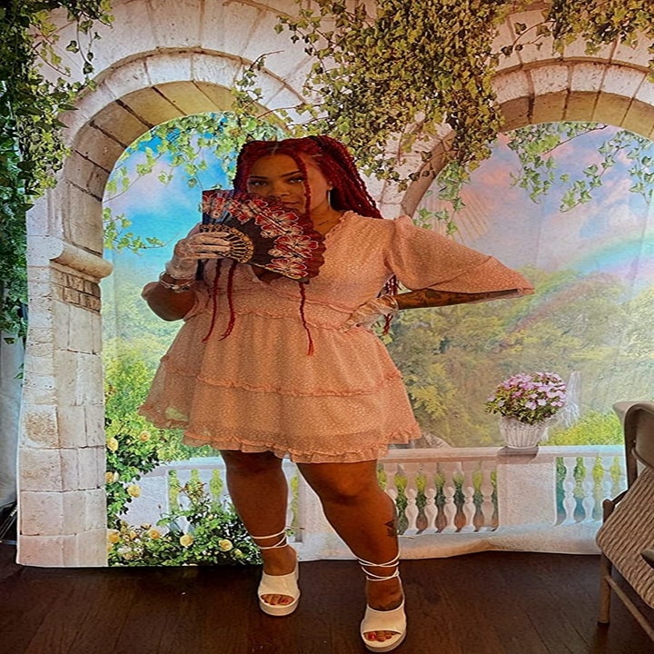 Reviewer wearing the floral pink dress