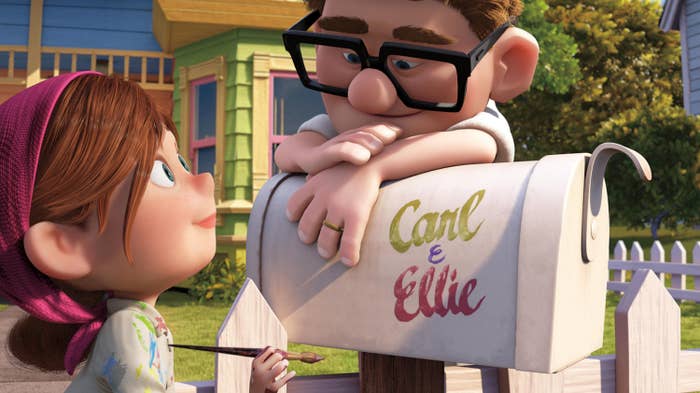 Carl and Ellie looking at each other next to their &quot;Carl &amp;amp; Ellie&quot; mailbox