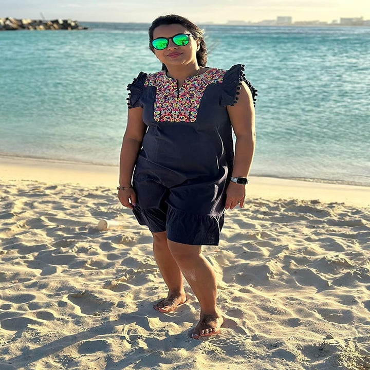 Reviewer wearing the navy dress