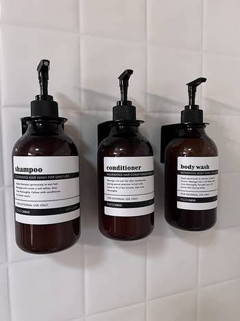 Reviewer's bottles are mounted to the shower wall