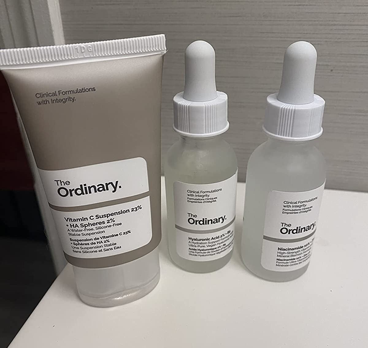 Reviewer image of three products from The Ordinary