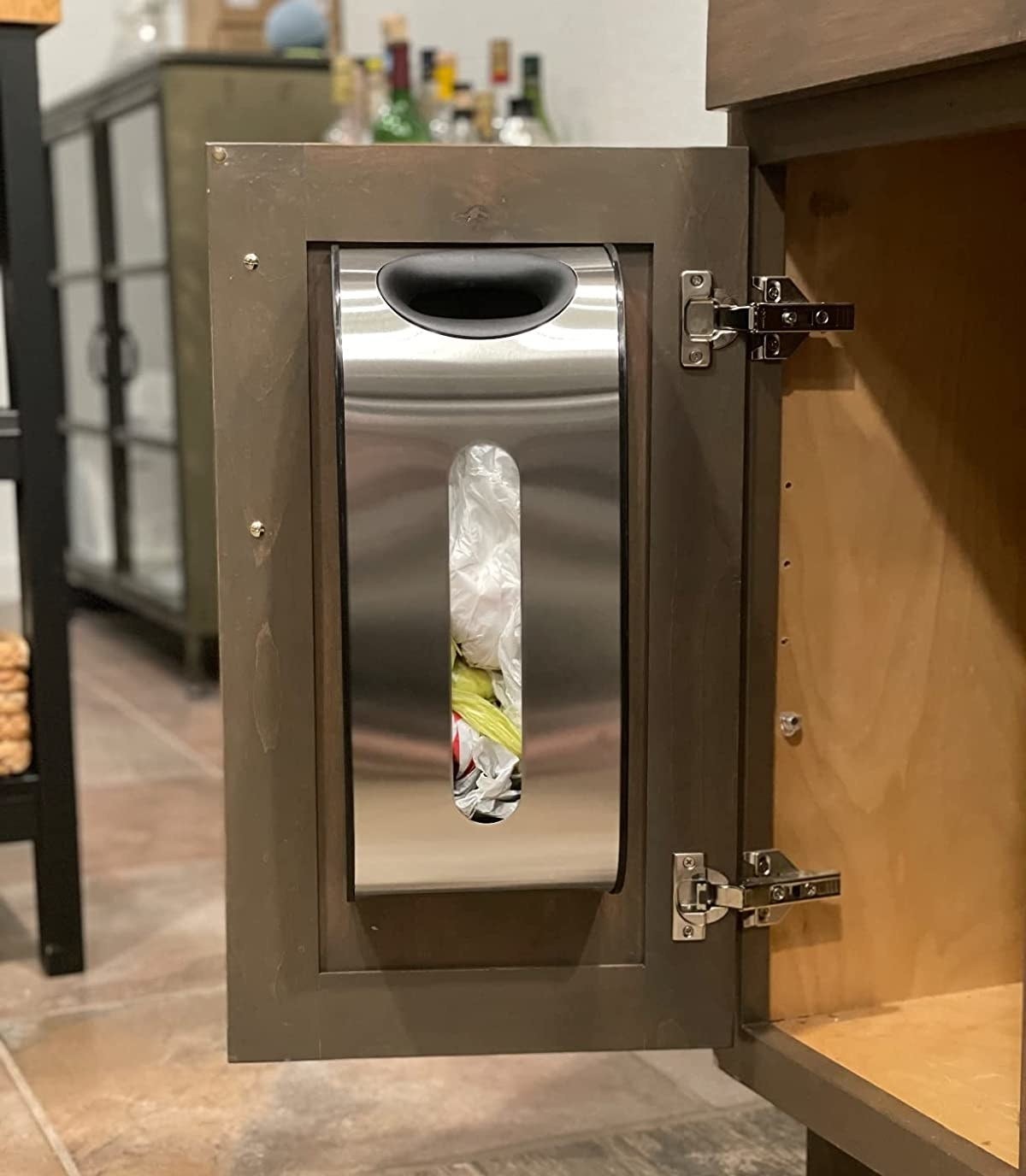 Reviewer image of bag dispenser on a cabinet door