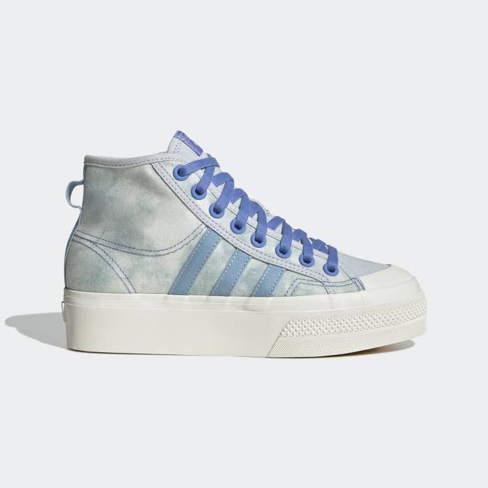 Baby blue colored hightop sneaker with white platform sole