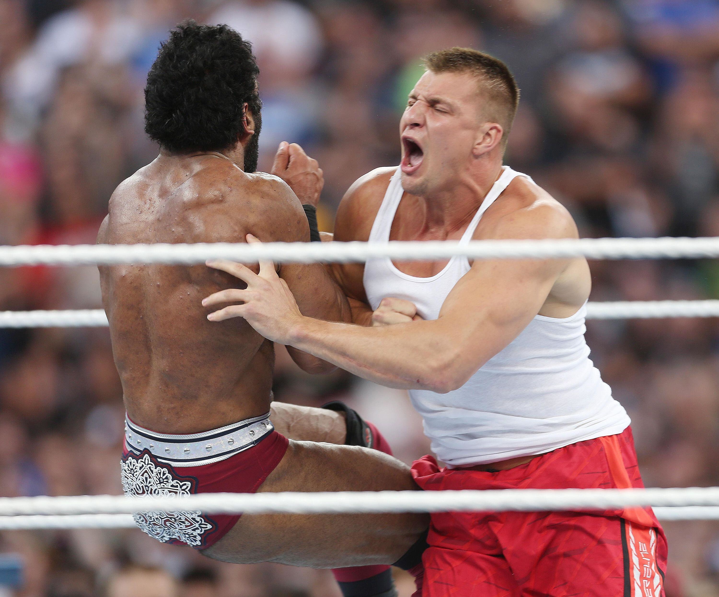 New England Patriots tight end Rob Gronkowski, right, screams as he hits wrestler Jinder Mahal, left, in the ring during WrestleMania 33 on Sunday, April 2, 2017 at Camping World Stadium in Orlando, Florida