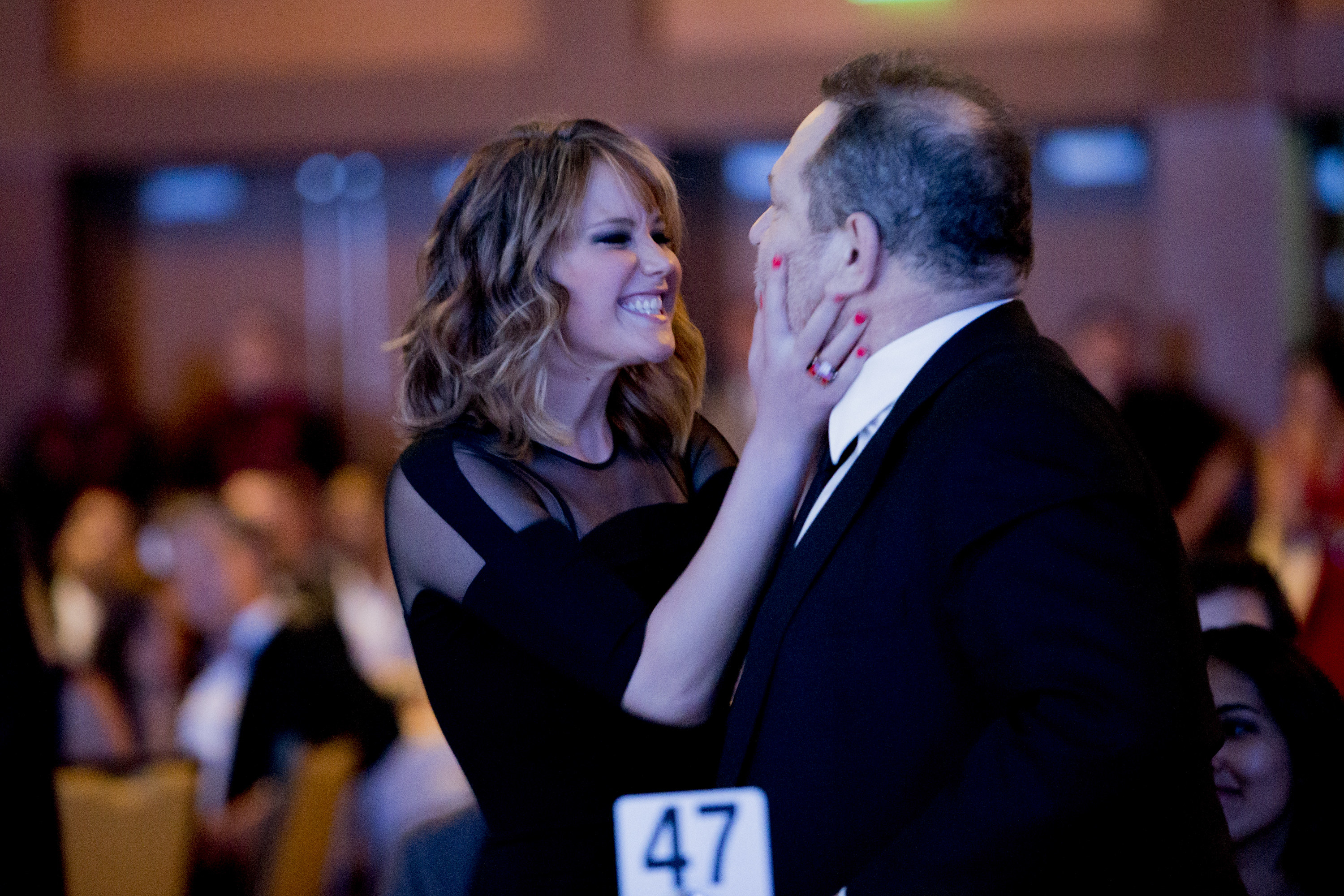 Jennifer squeezes Harvey Weinstein&#x27;s face while grinning at him