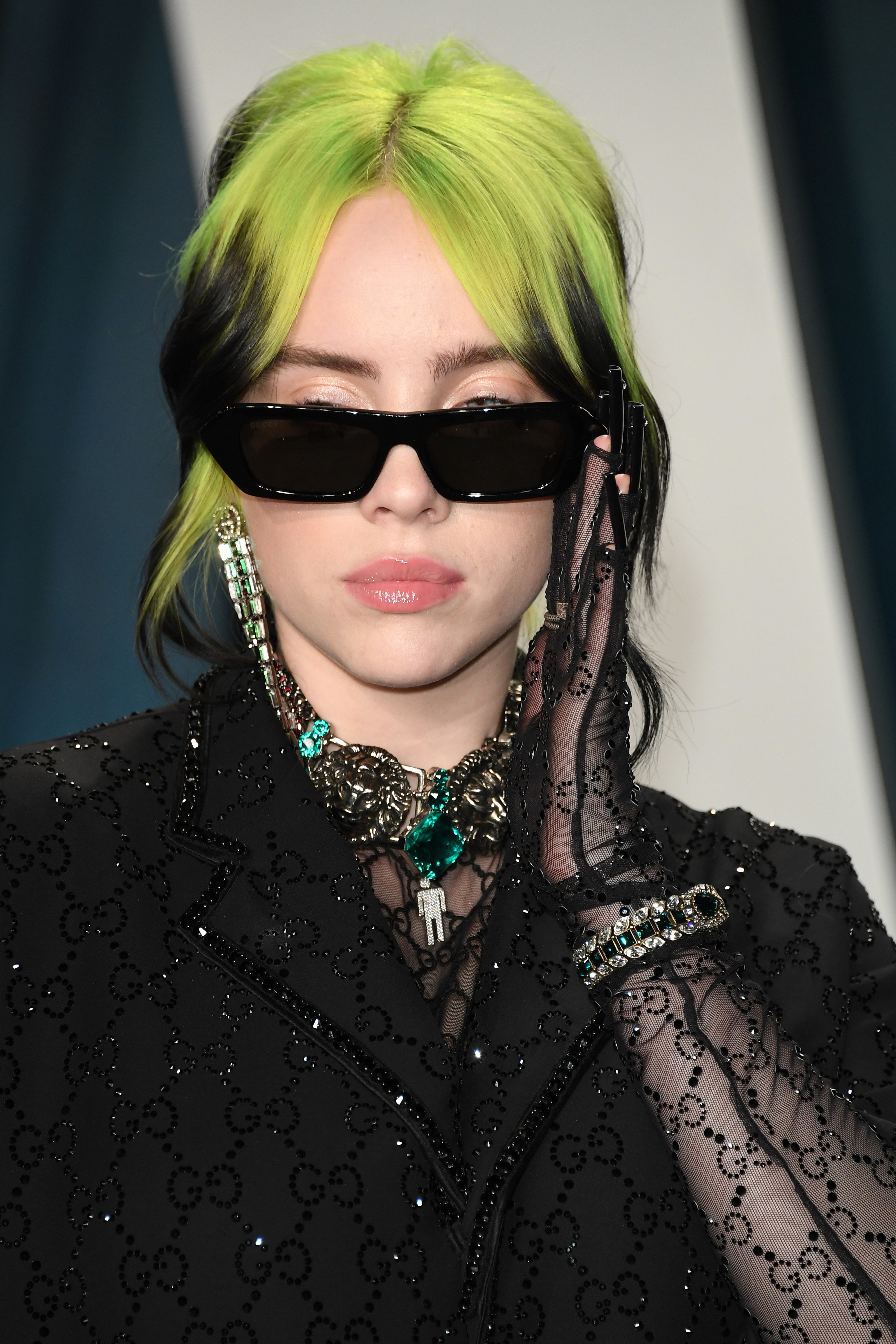 Close-up of Billie wearing sunglasses and multicolored hair