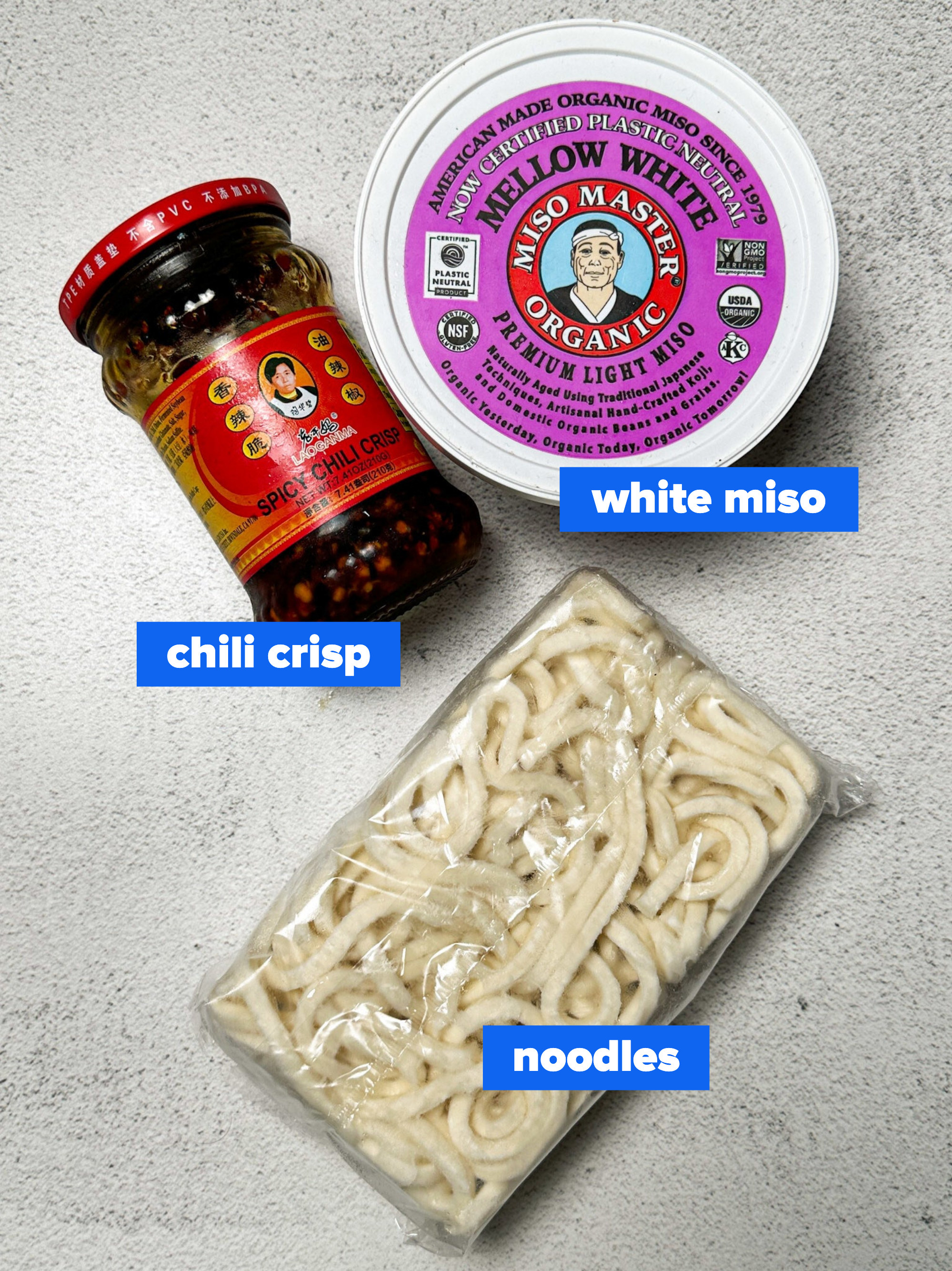 the ingredients: white miso, chili crisp, frozen udon noodles