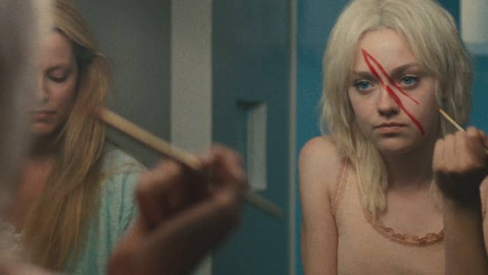 Cherrie Currie painting on her makeup in the film