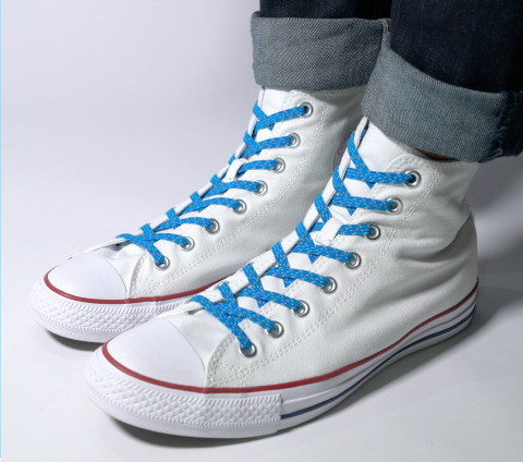 the no tie laces in a pair of high top sneakers