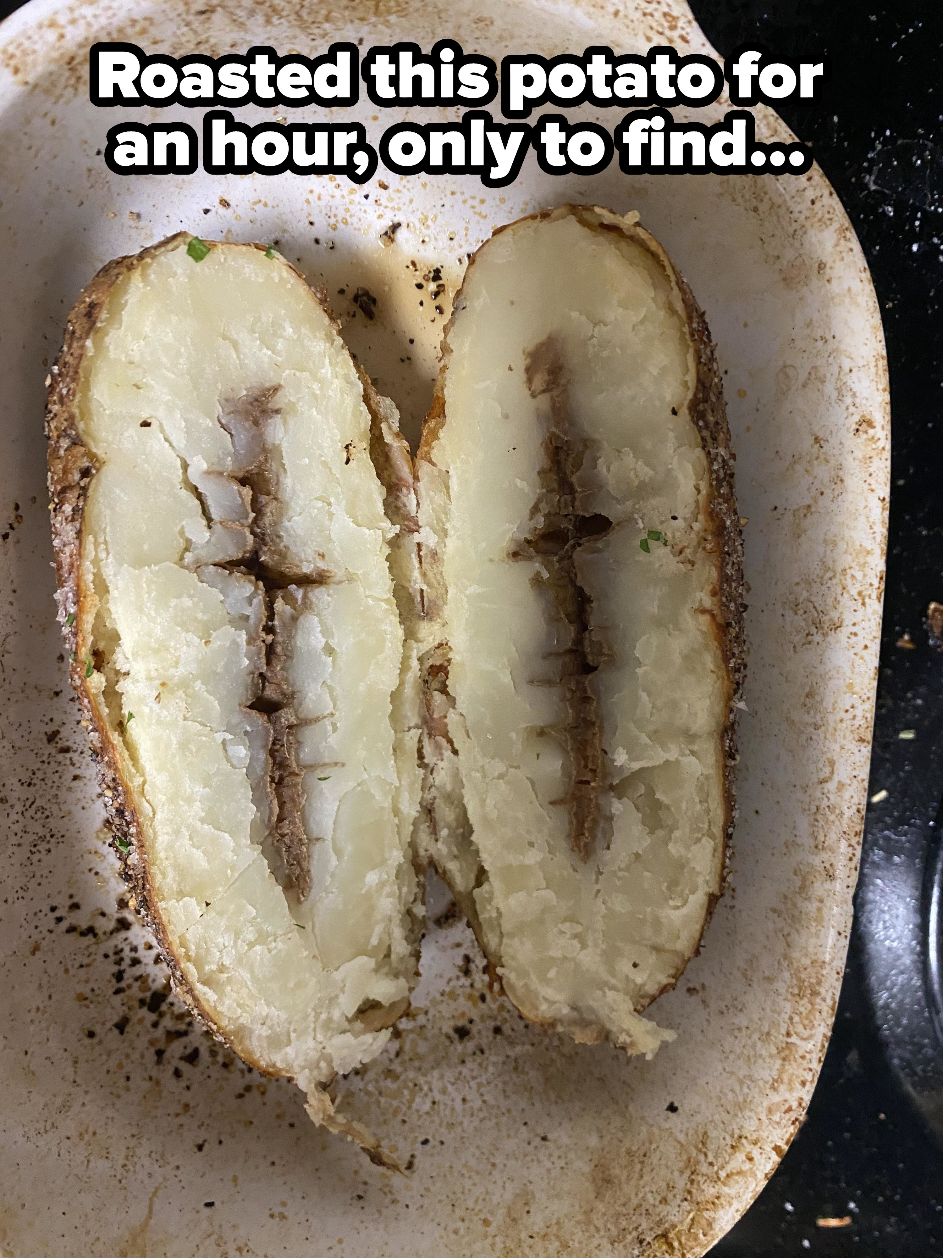 A baked potato cut in half and showing the rotten core
