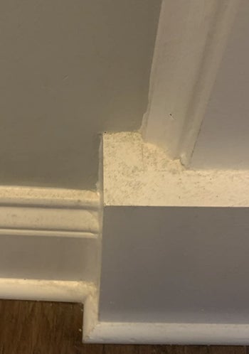 reviewer showing their dirty baseboards