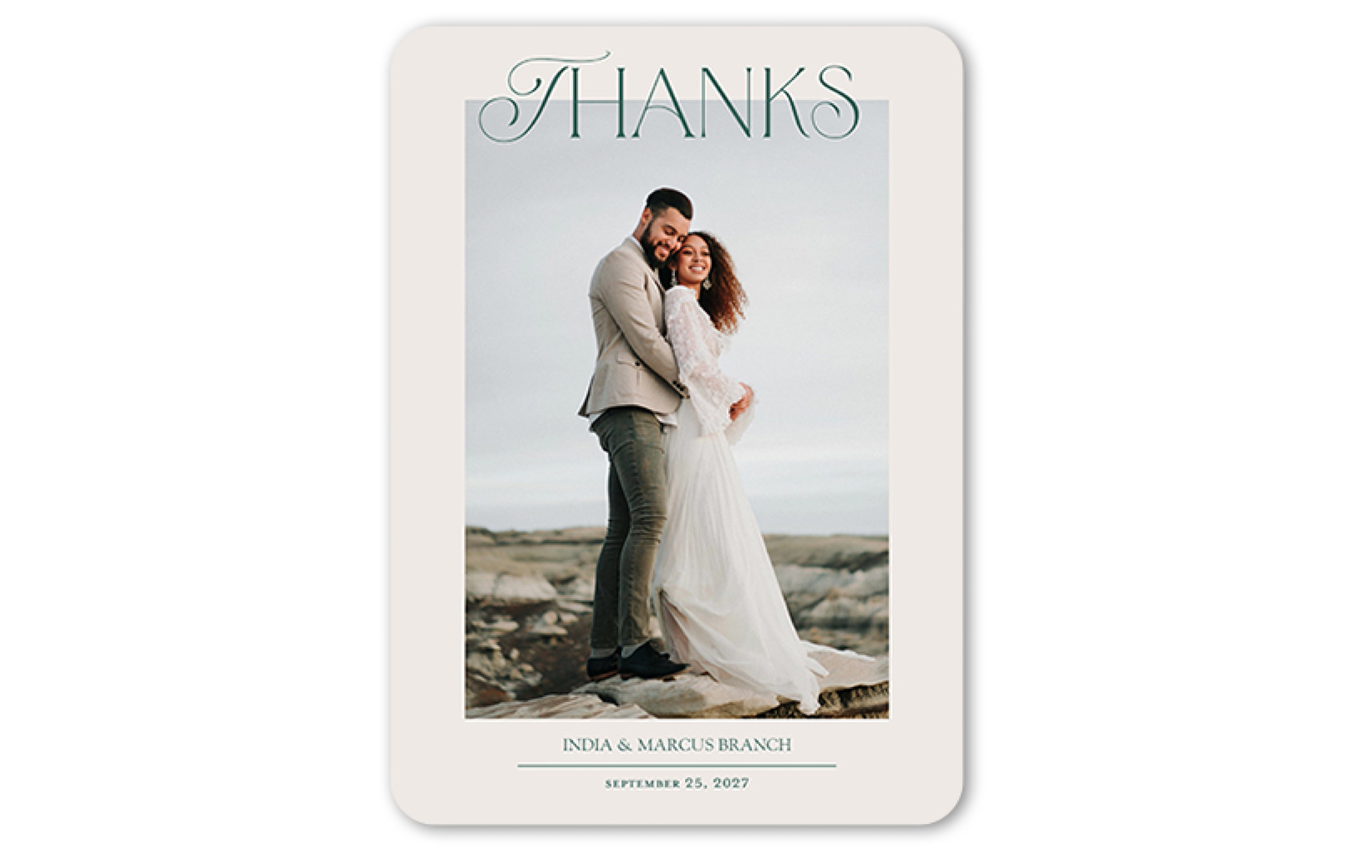 Thank-you card with the word &quot;thanks&quot; written on it, picture of couple, and date of wedding