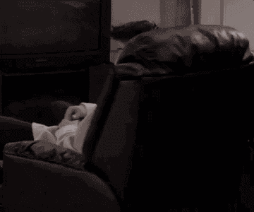 joey from friends spinning around in a recliner chair and then waving