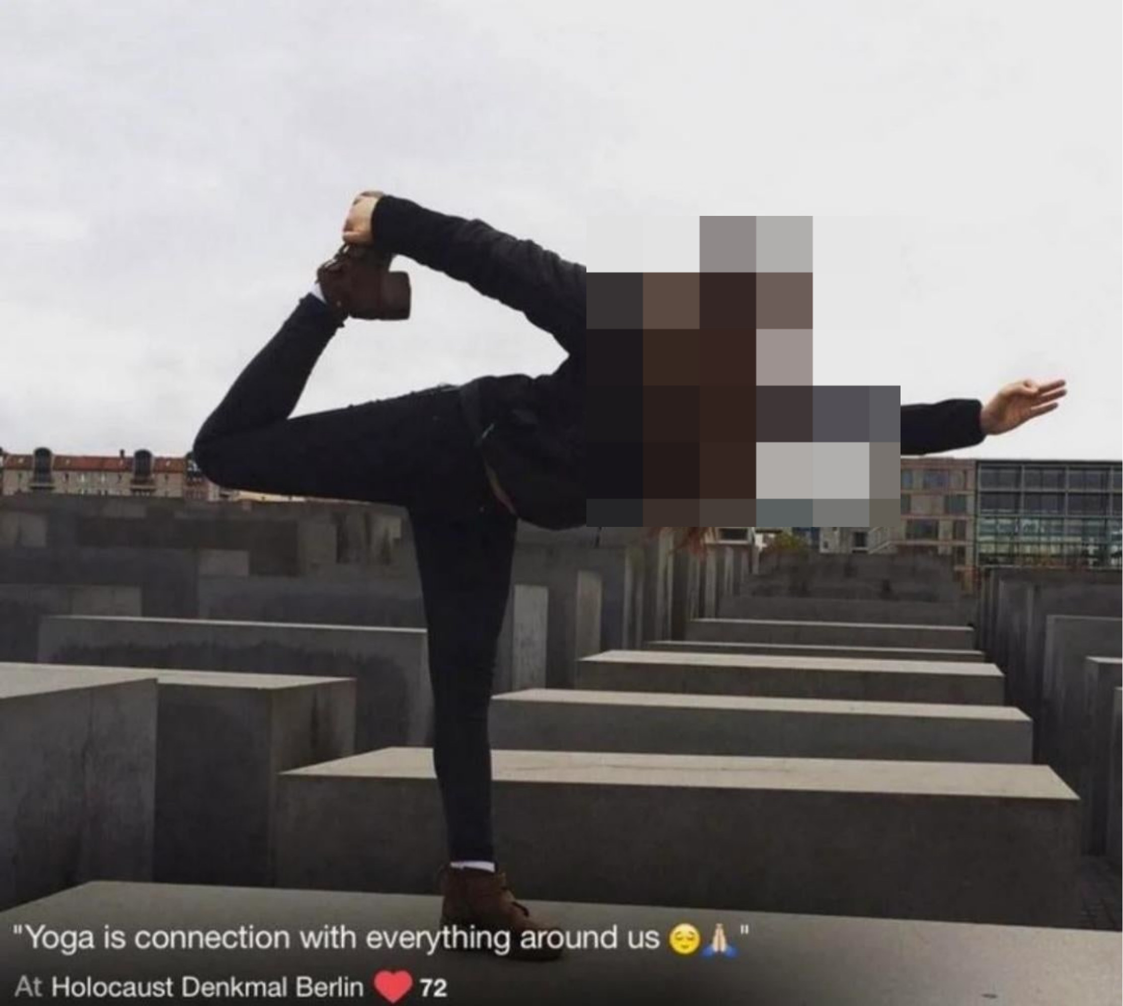 A person doing a yoga pose at a Holocaust memorial