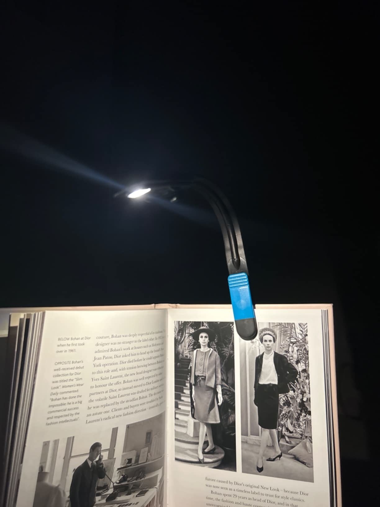 Reviewer's book illuminated clearly in pitch blackness thanks to the light clipped atop book