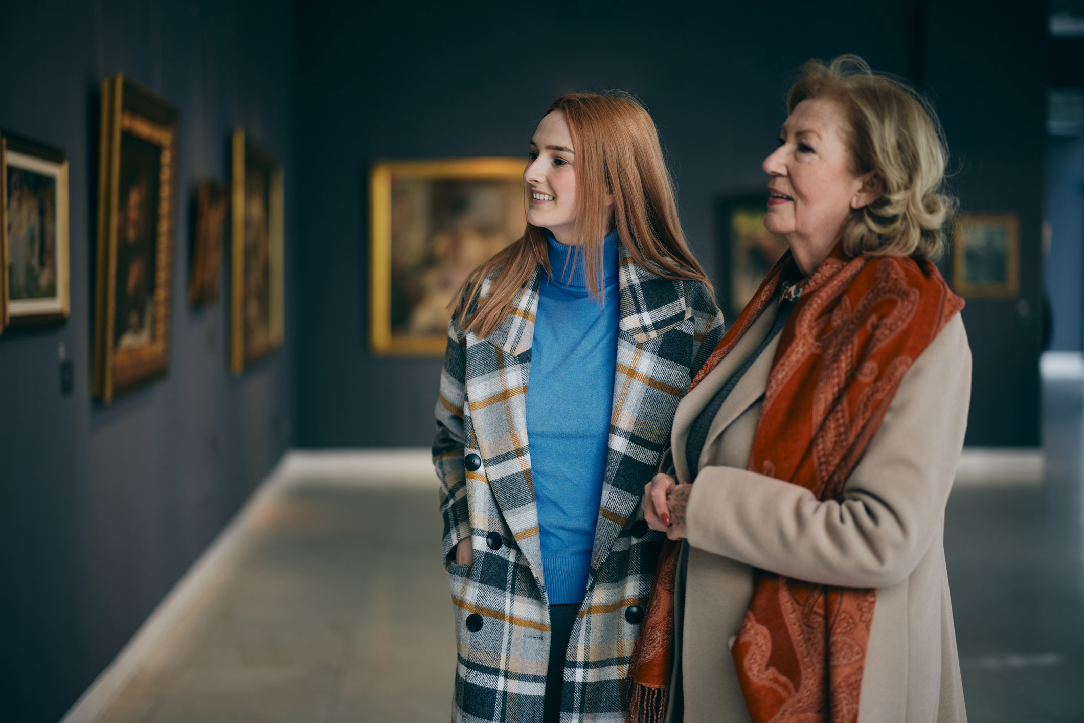 A young woman with her grandmother at a museum