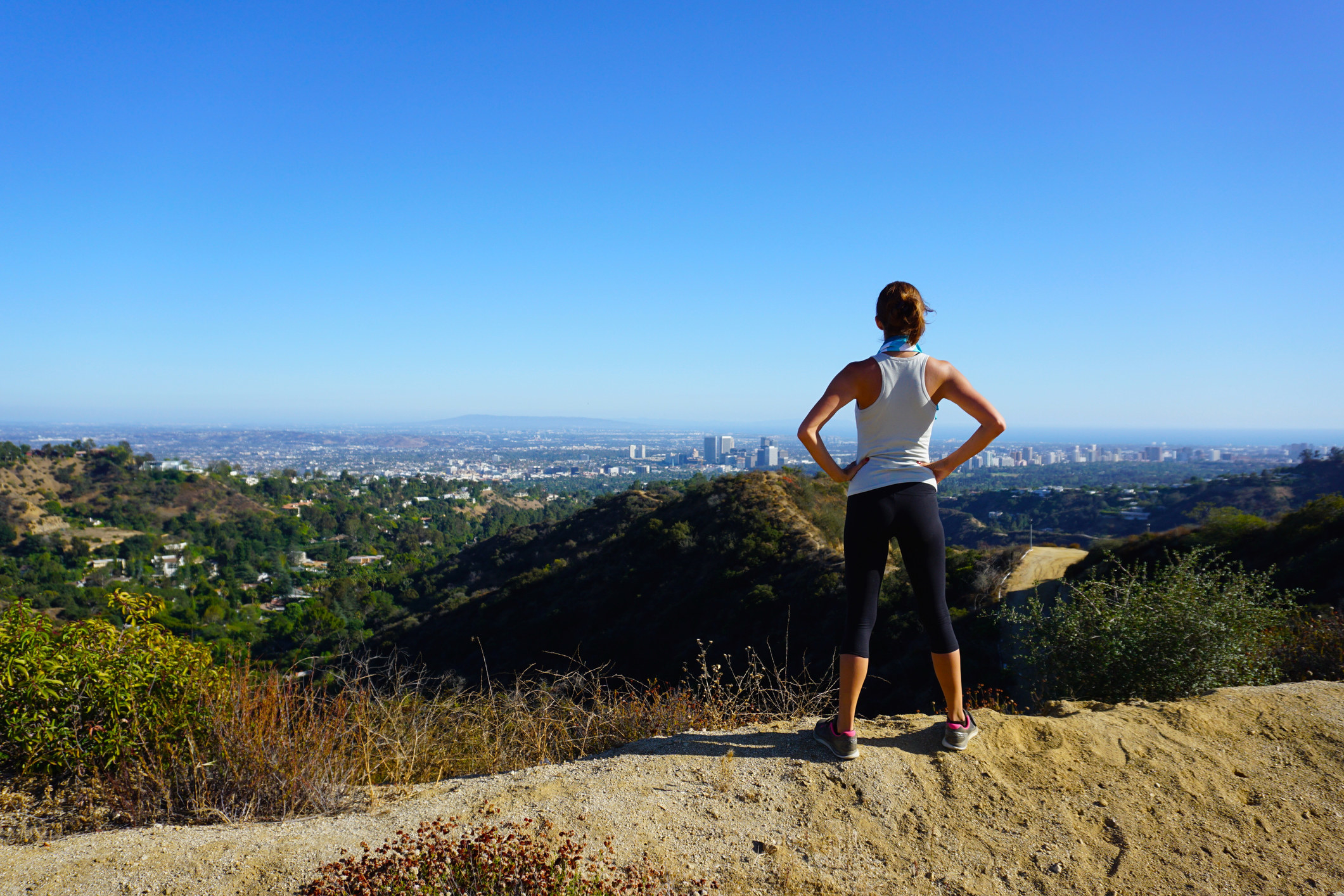 A woman taking in the hiking views of Los Angeles