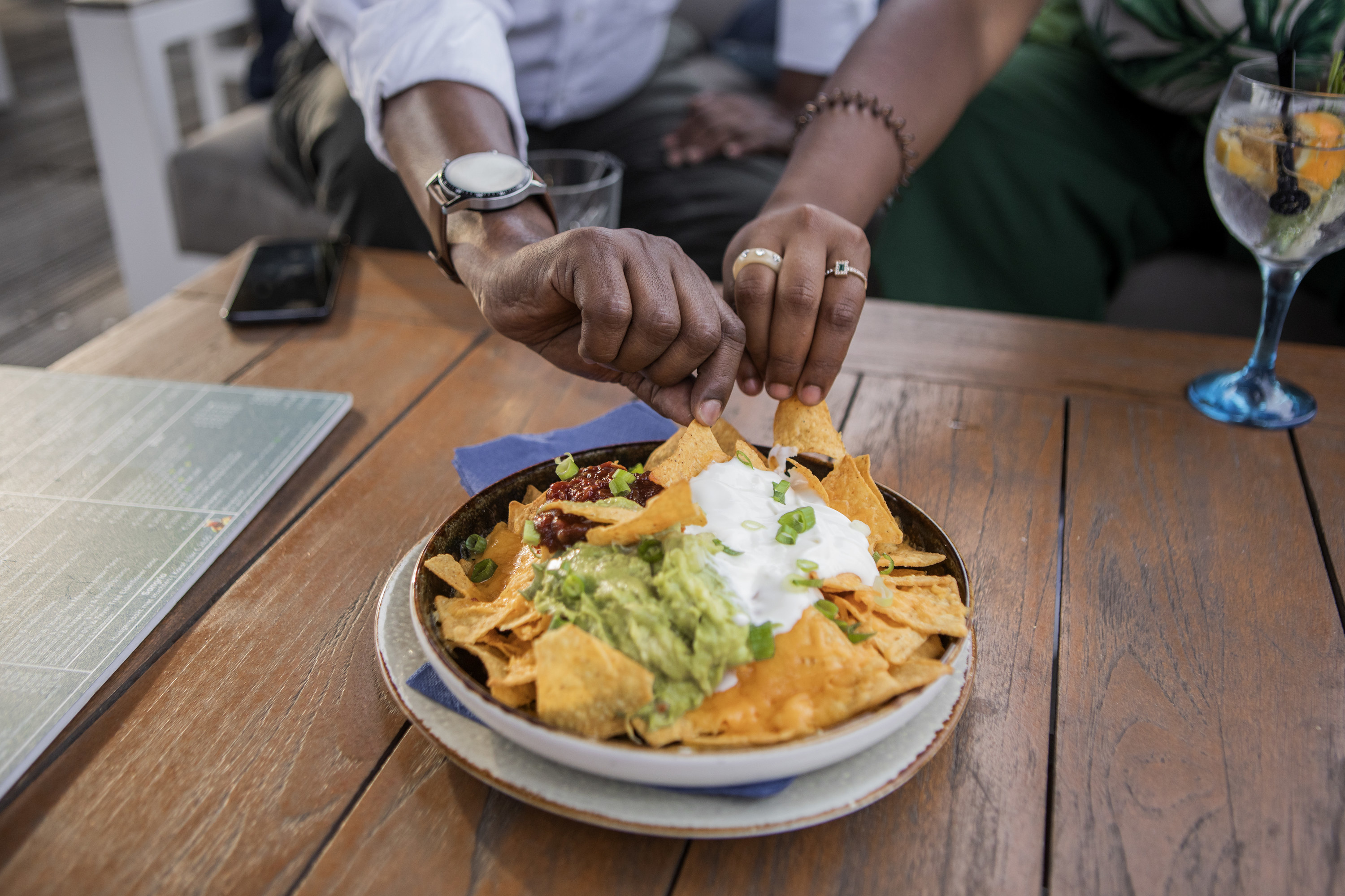 couple sharing a plate of nachos