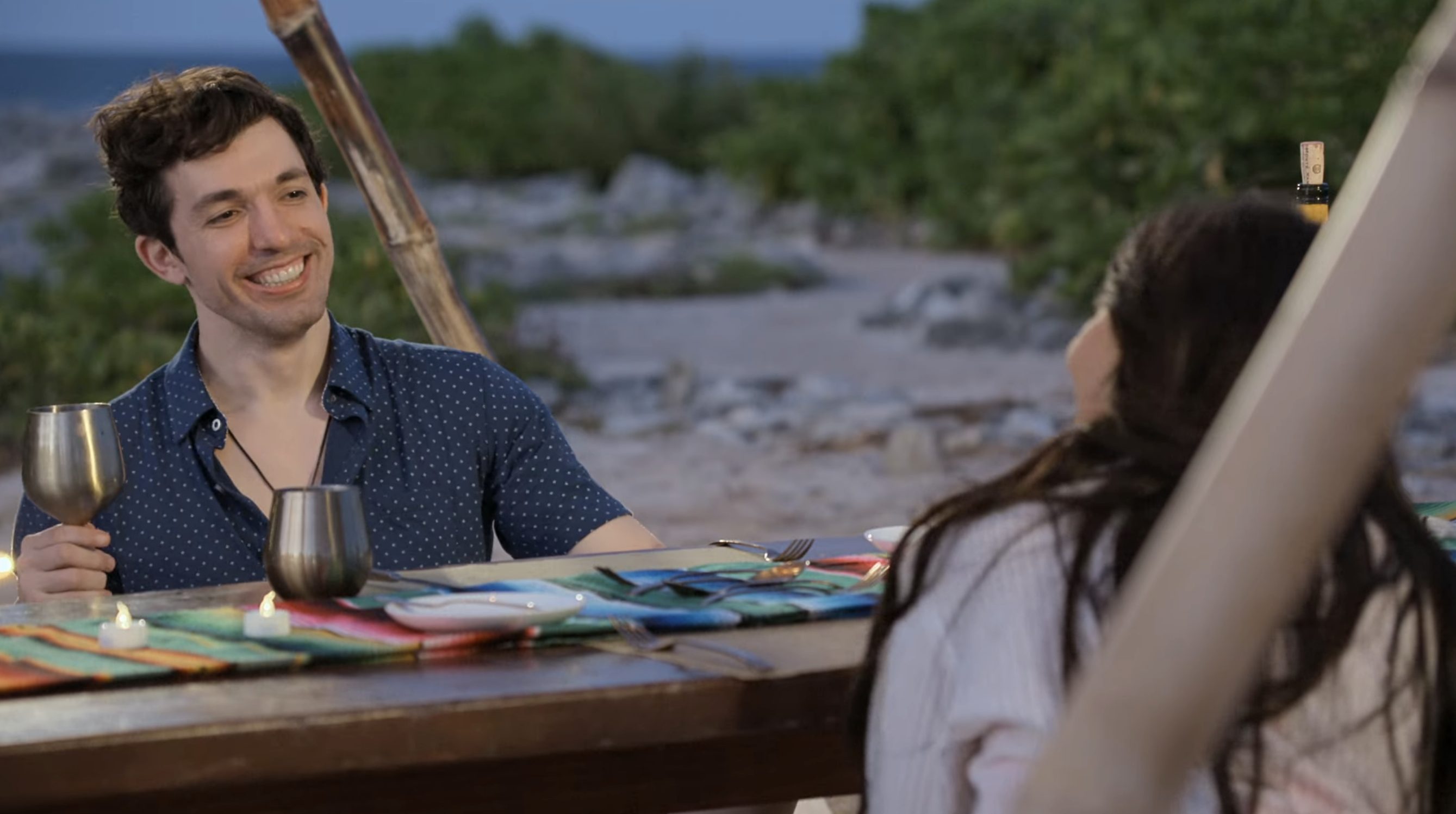 Zack and Irina smiling at a table