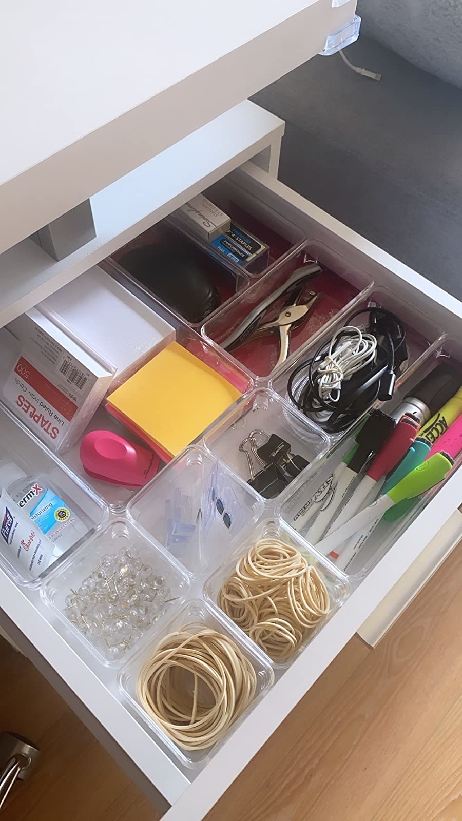 a reviewer photo of a very organized desk drawer using the clear containers