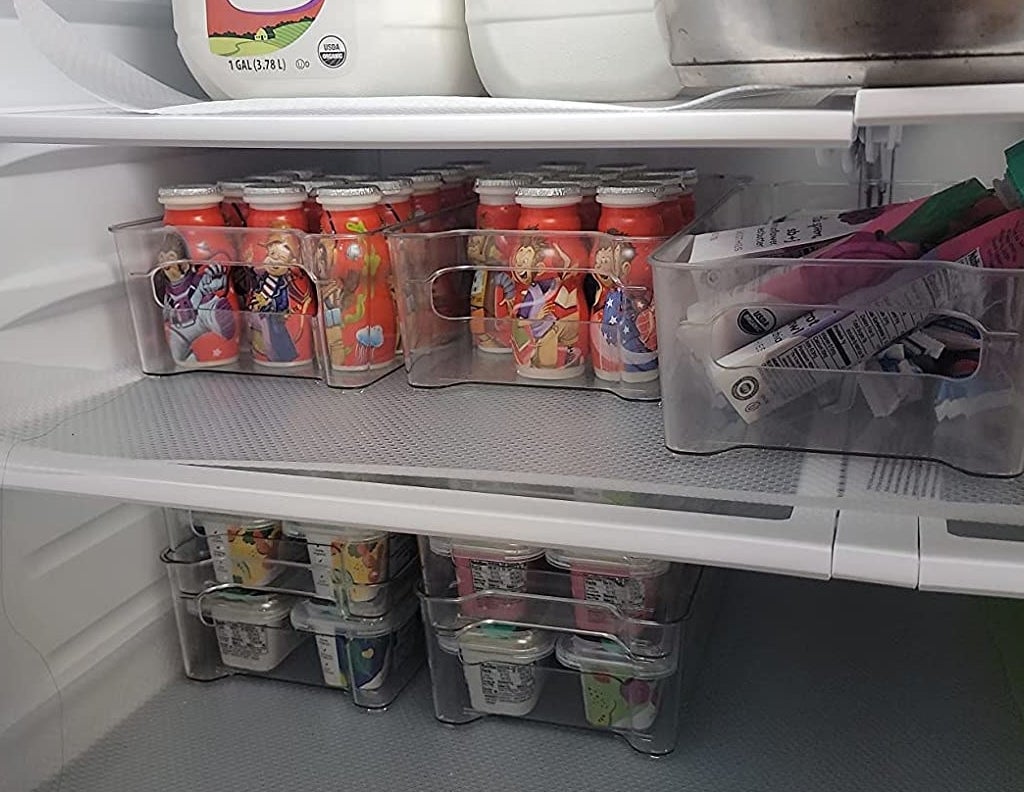 a reviewer photo of a neat fridge with yogurts and pouches in the bins