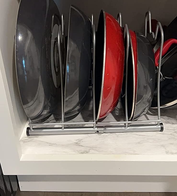 a reviewer photo of the silver wire rack full of vertical pans