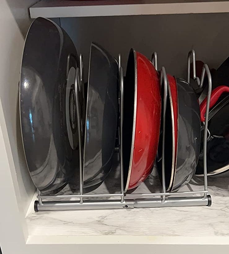 a reviewer photo of the silver wire rack full of vertical pans