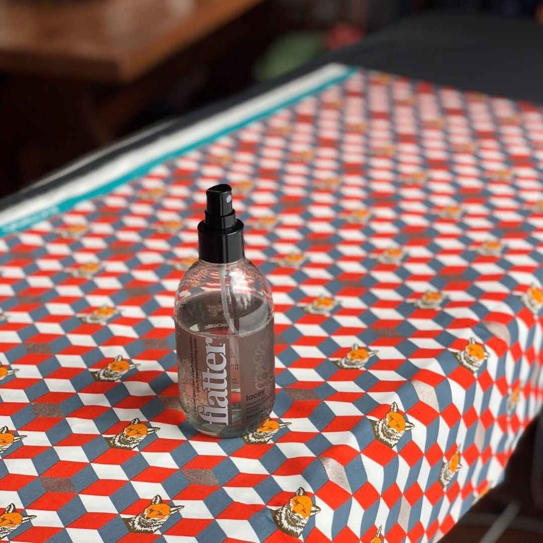 the wrinkle releaser on a printed table cloth