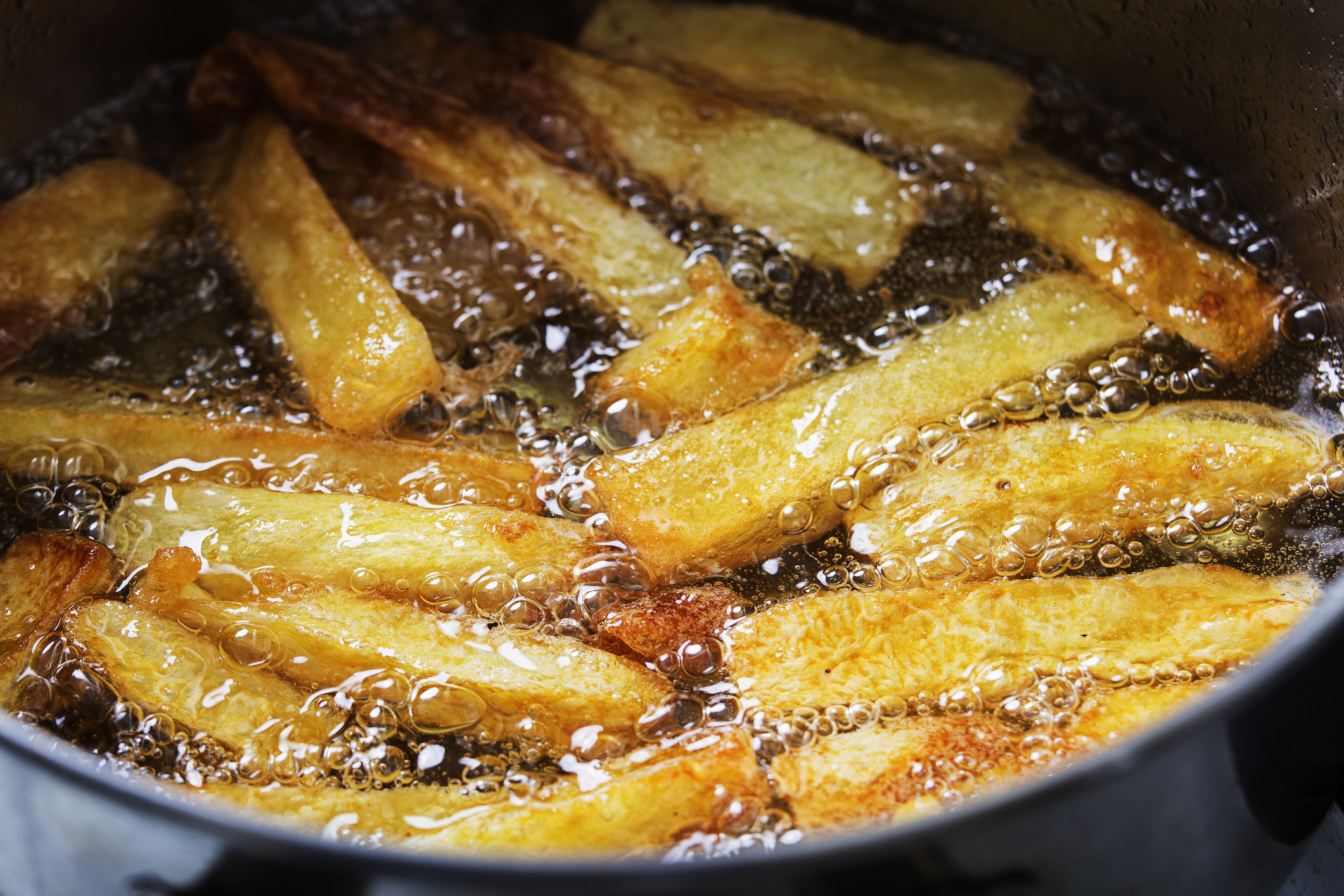 French fries frying in oil.