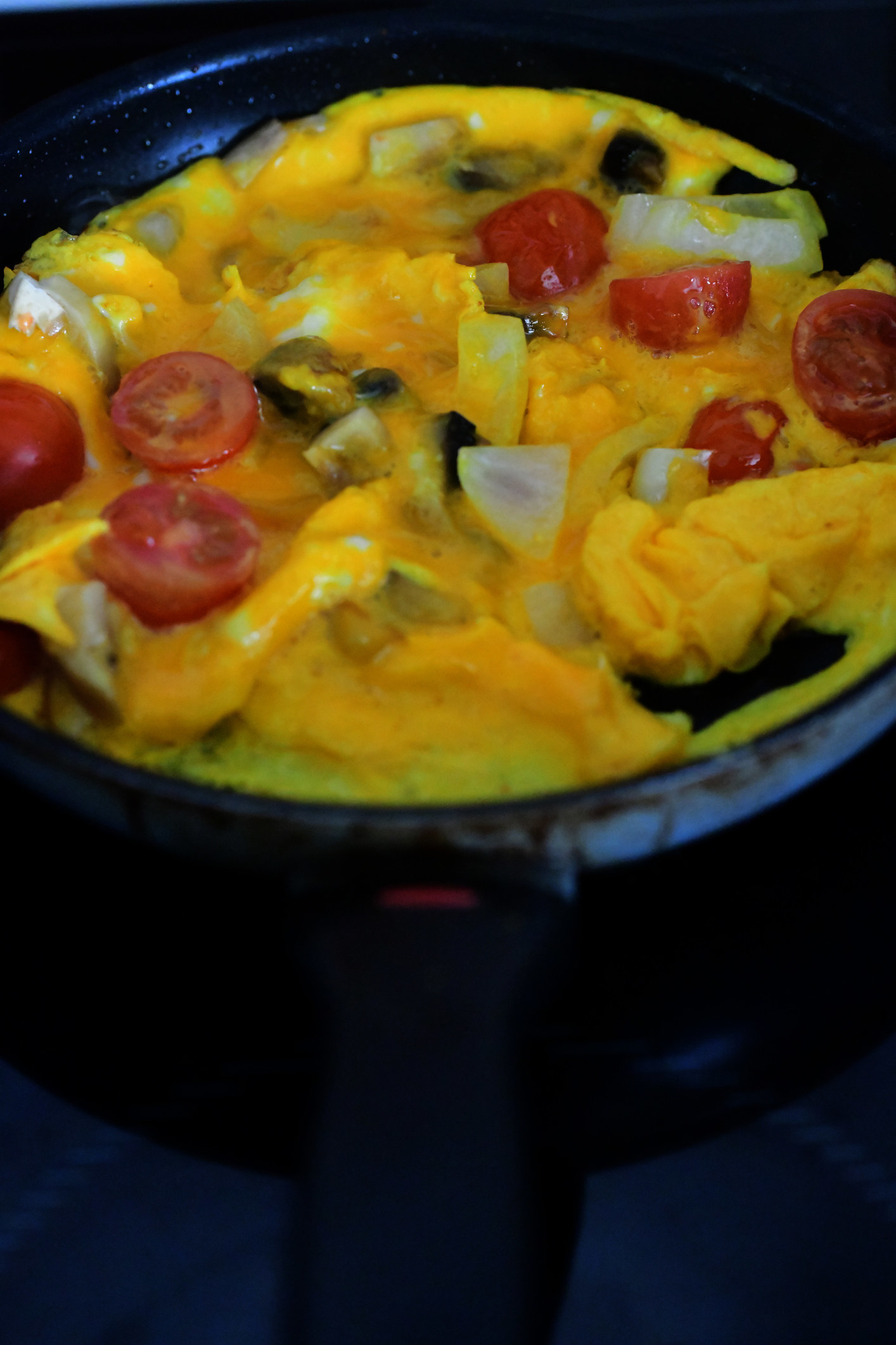 Cooking a vegetable omelet.
