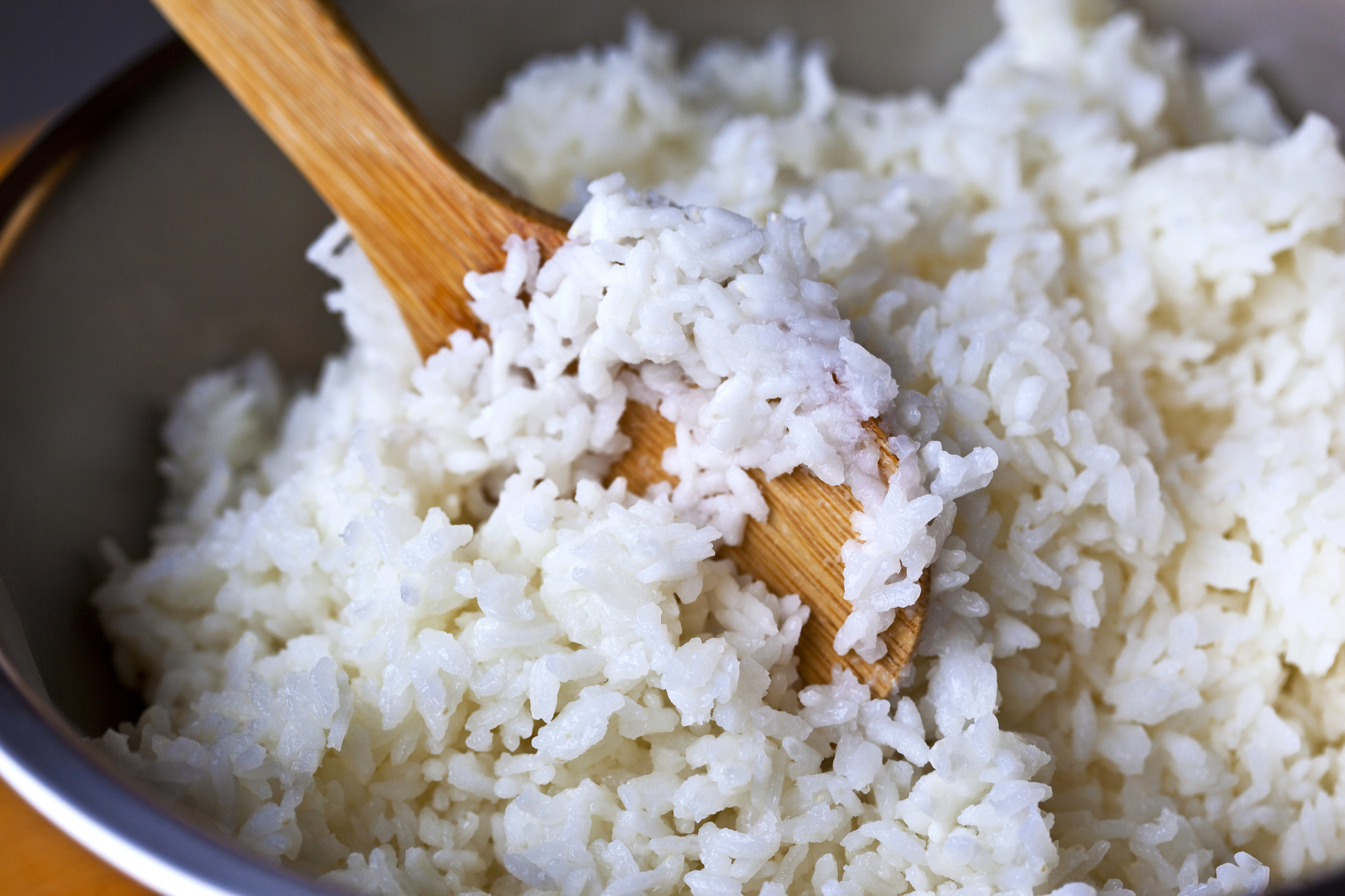 Stirring a pot of rice.