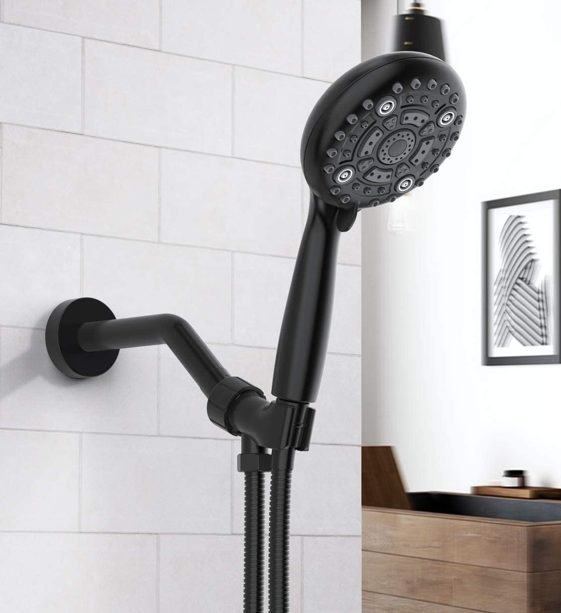 the shower head on a tiled wall