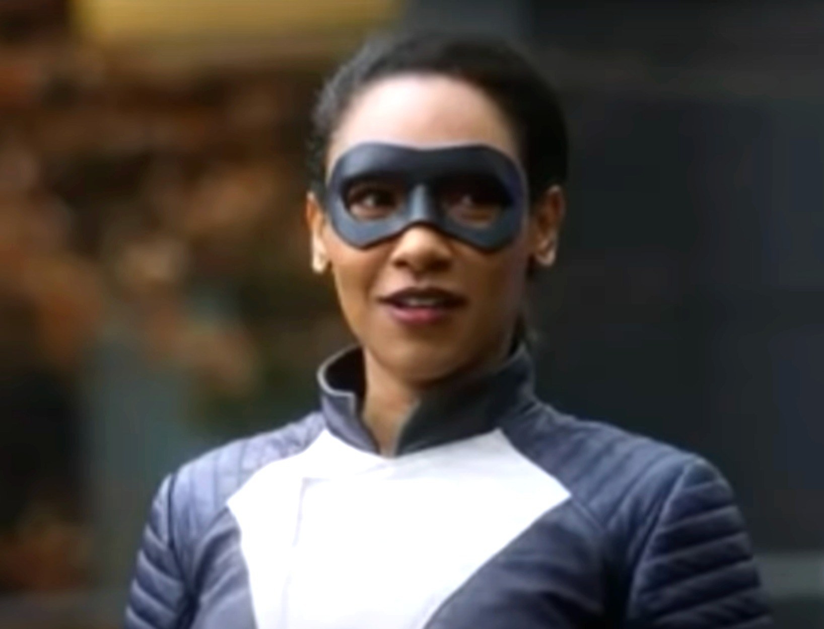 closeup of iris in a superhero costume and eye mask