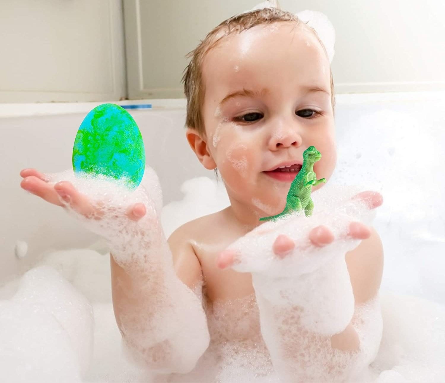 a toddler in a bubble bath holding a bath bomb and dinosaur toy