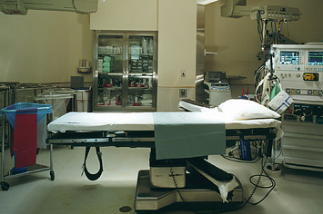 Operating room, lights shining on operating table