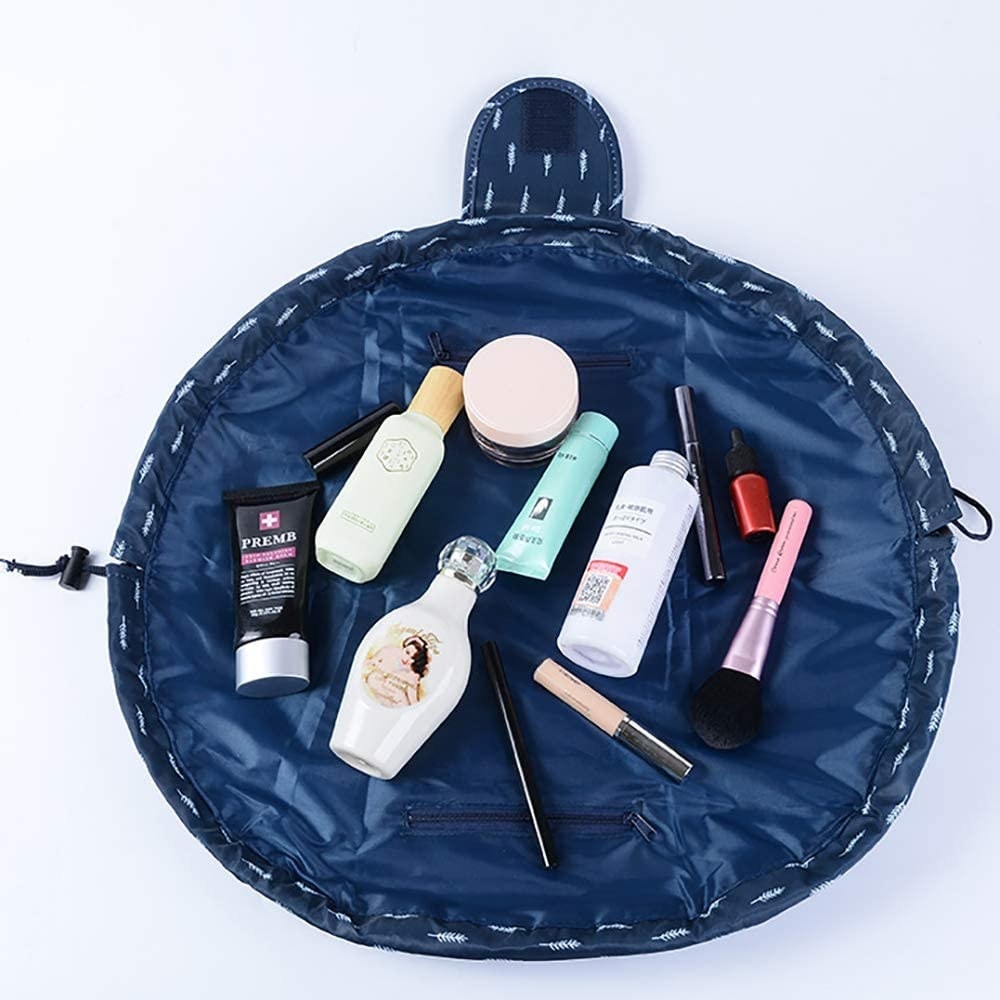 The makeup bag open with products in it