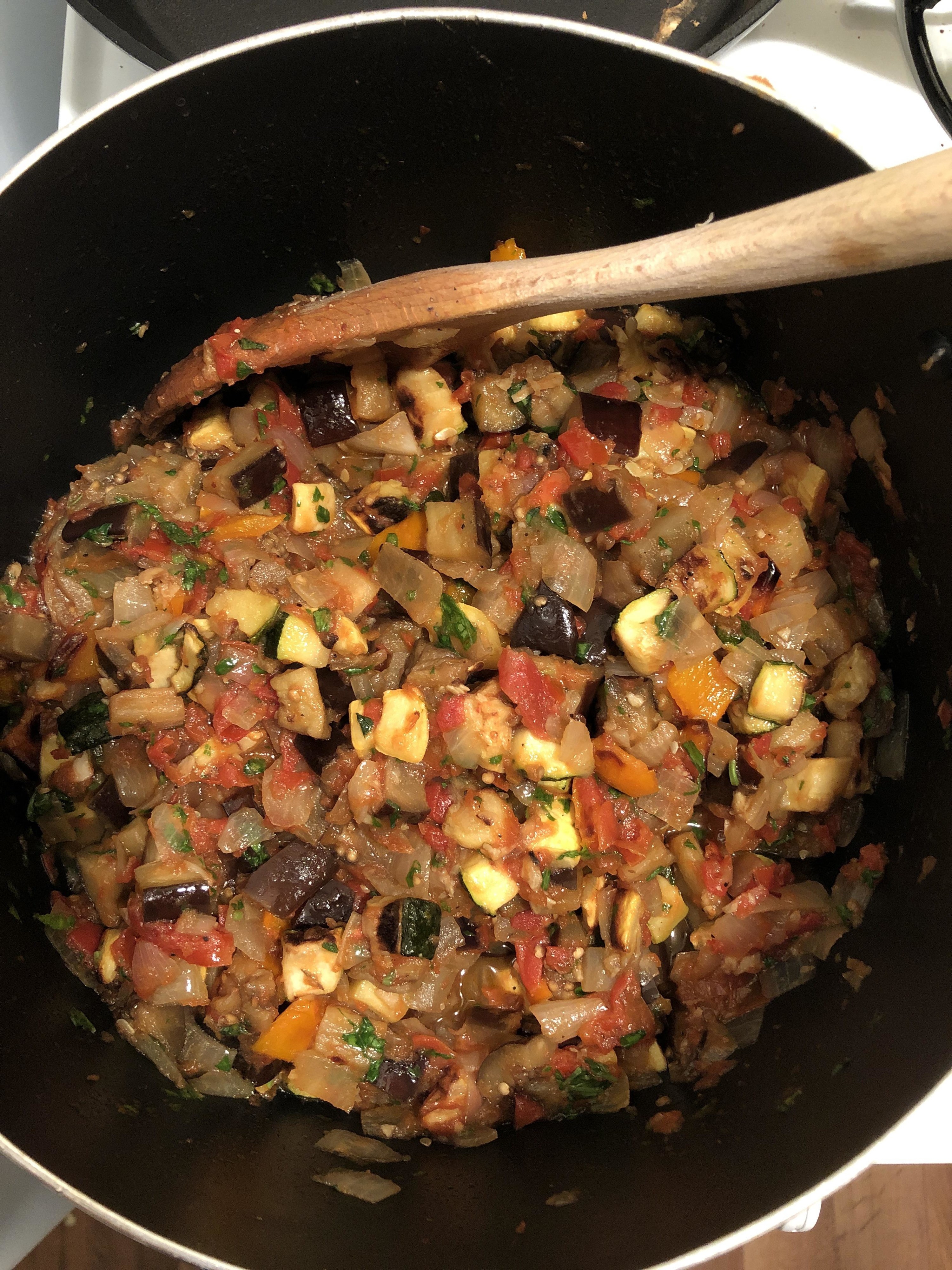 pot of ratatouille with eggplant, zucchini, tomatoes, and more