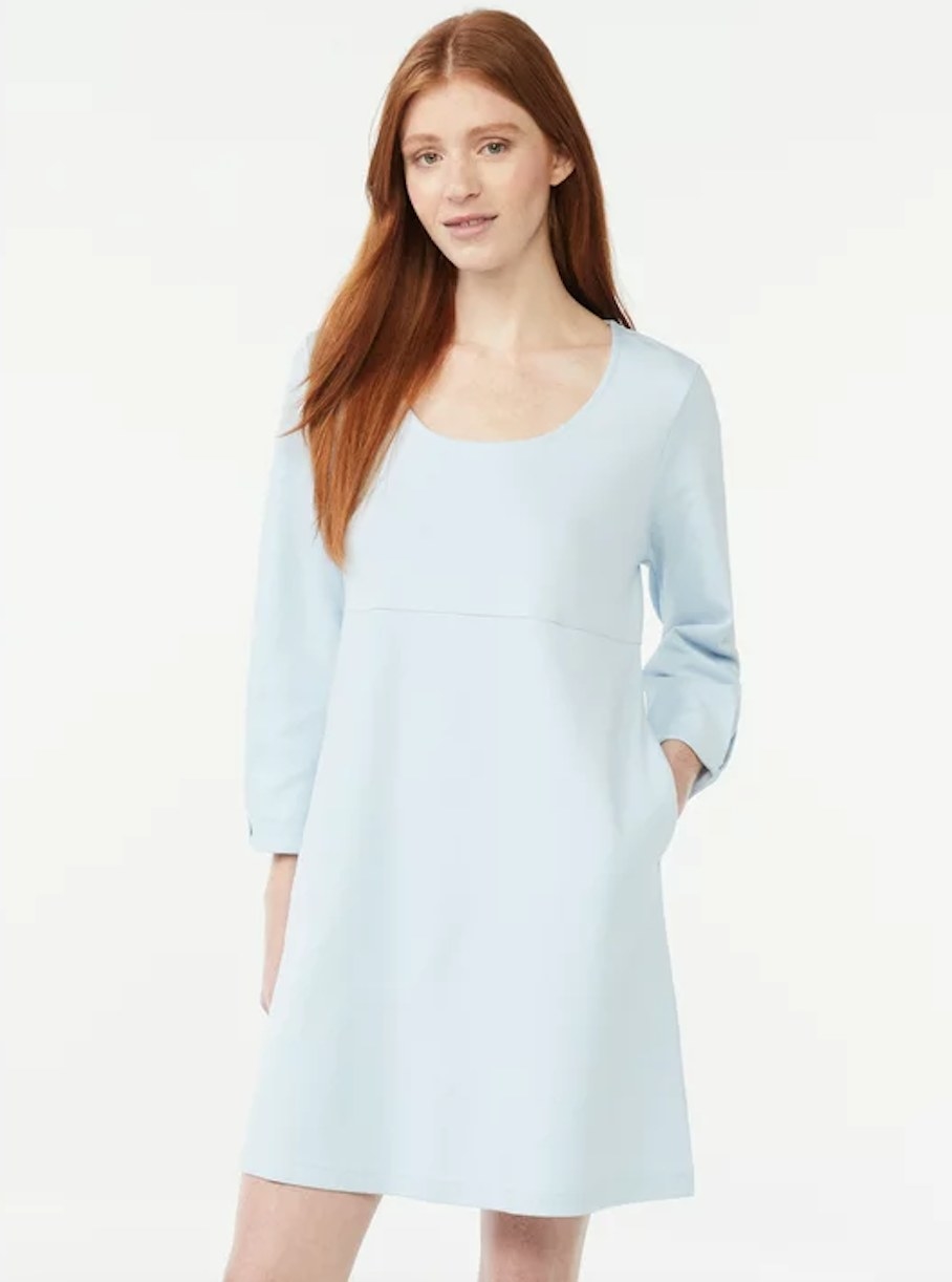 Model wearing u-neck long sleeve mini dress in baby blue