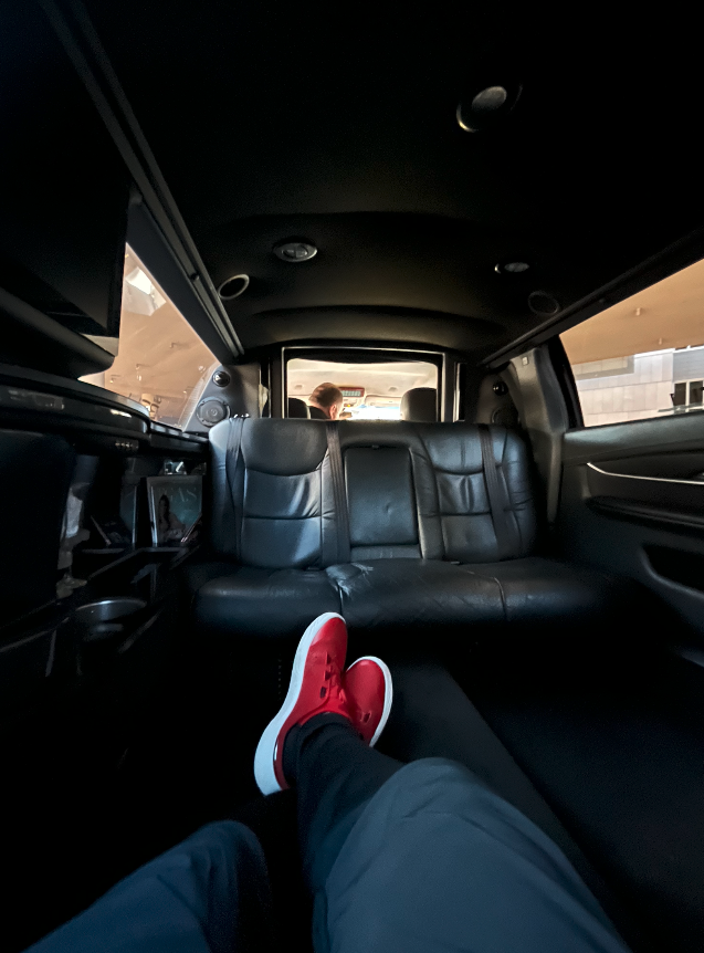pov view of the author sitting in a limo