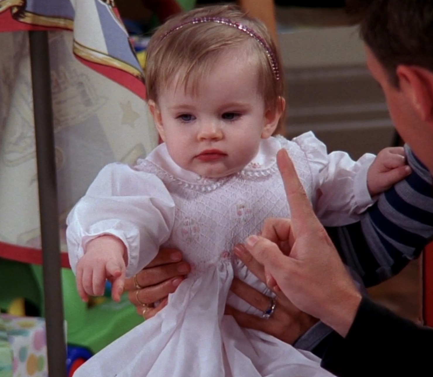Emma sits with Monica and Chandler during Emma&#x27;s first birthday celebration