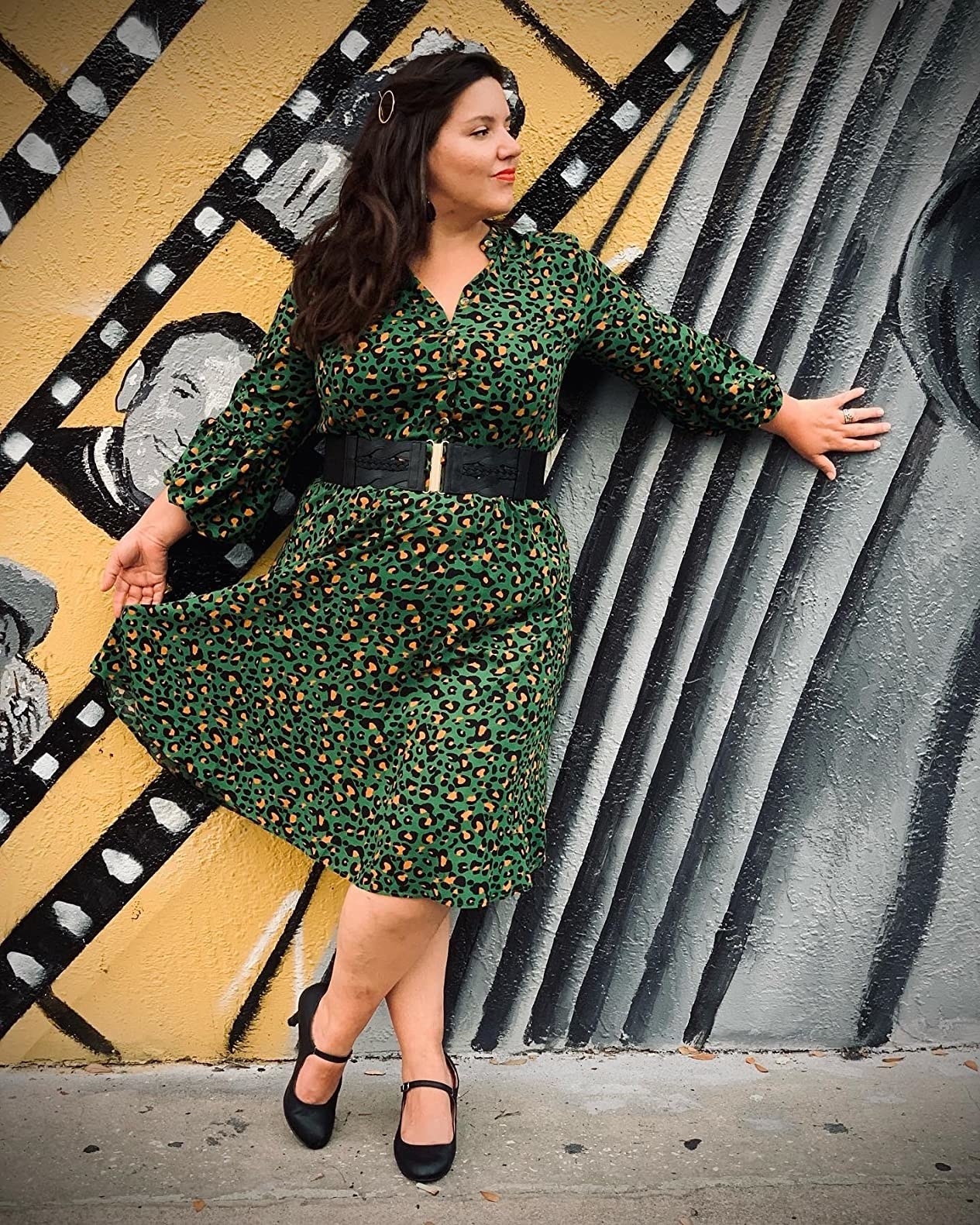 Reviewer wearing the dress in green leopard print