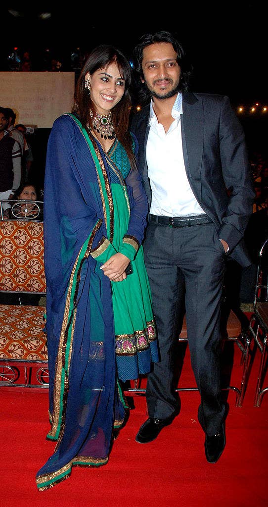 Indian Bollywood actor Ritesh Deshmuka (R) and Genelia D'Souza arrive at the Indian Television Colors' "Mumbai Police Umang 2011" Bollywood star show