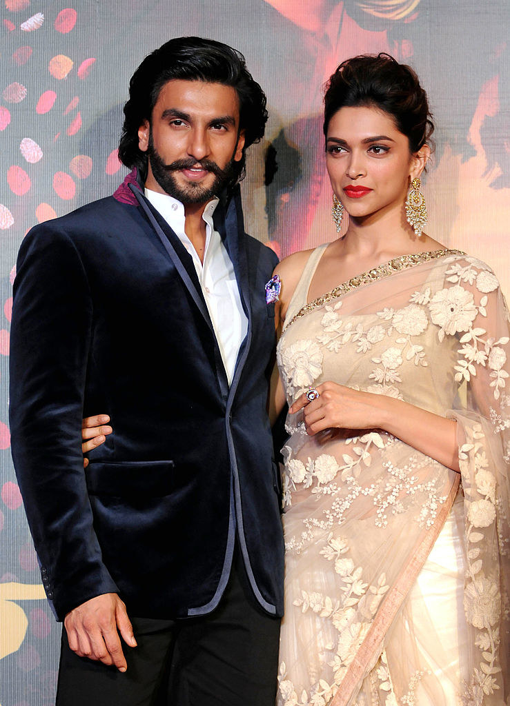 Indian Bollywood film actors Ranveer Singh (L) and Deepika Padukone attend their first look trailer launch