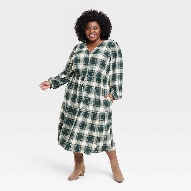 A model in the dress in green plaid