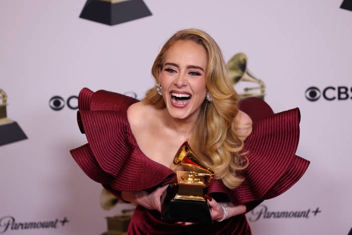 Closeup of Adele holding her Grammy
