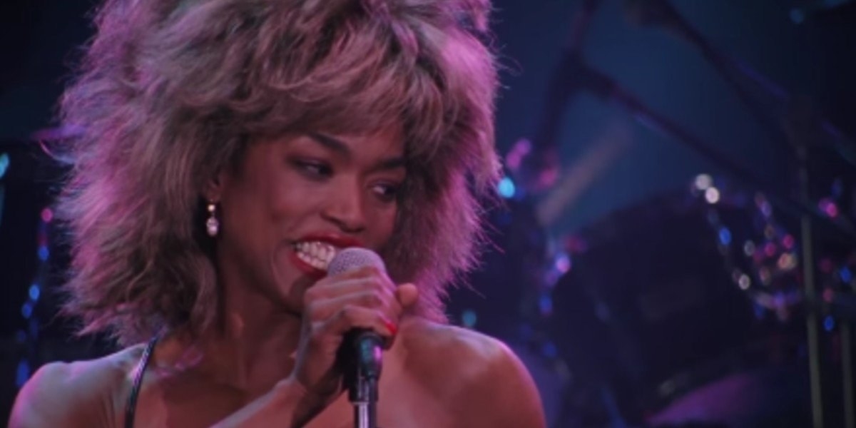 screencap of Angela performing as Tina Turner in the movie
