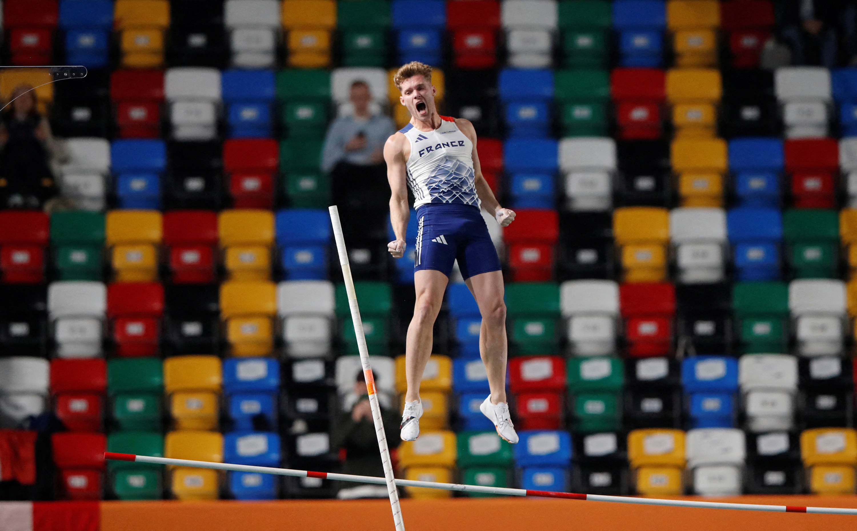 Mayer launches his body upward during the men&#x27;s pole vault heptathlon