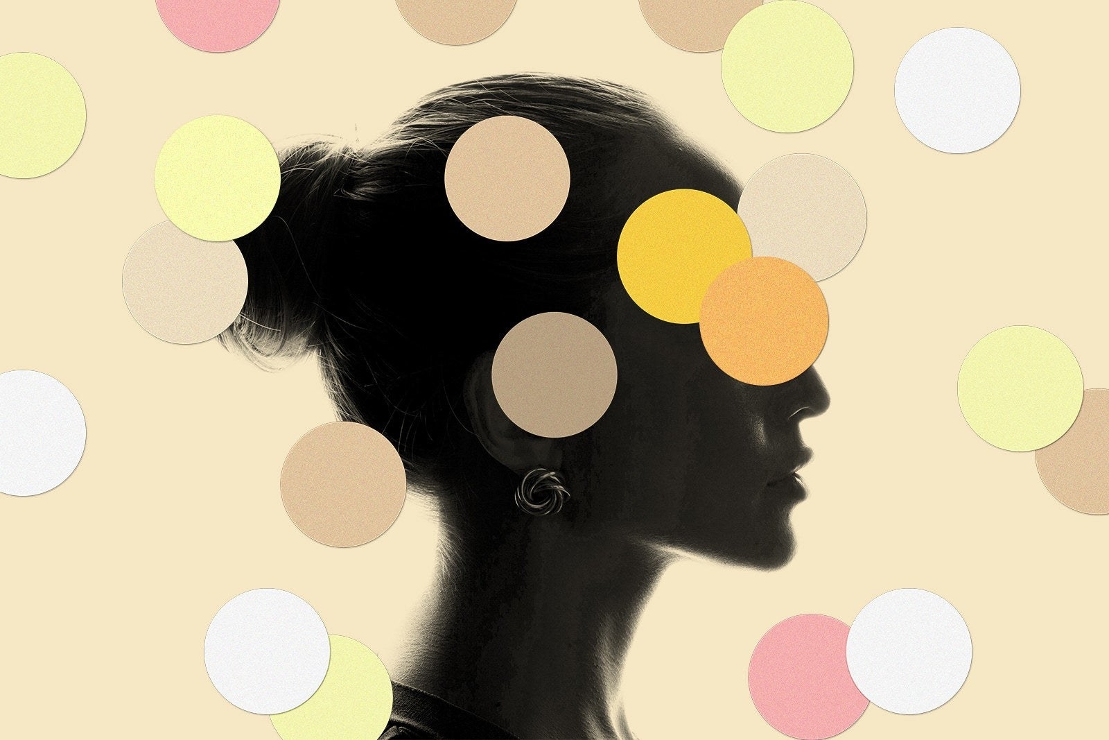 the darkened side profile of a woman&#x27;s face covered in netural polka dots