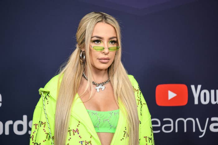 Tana Mongeau standing for a photo during a red carpet for youtube streamy awards
